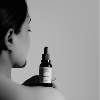 Founder Pooja Walia holding Green Glow Seed Glow Face Oil